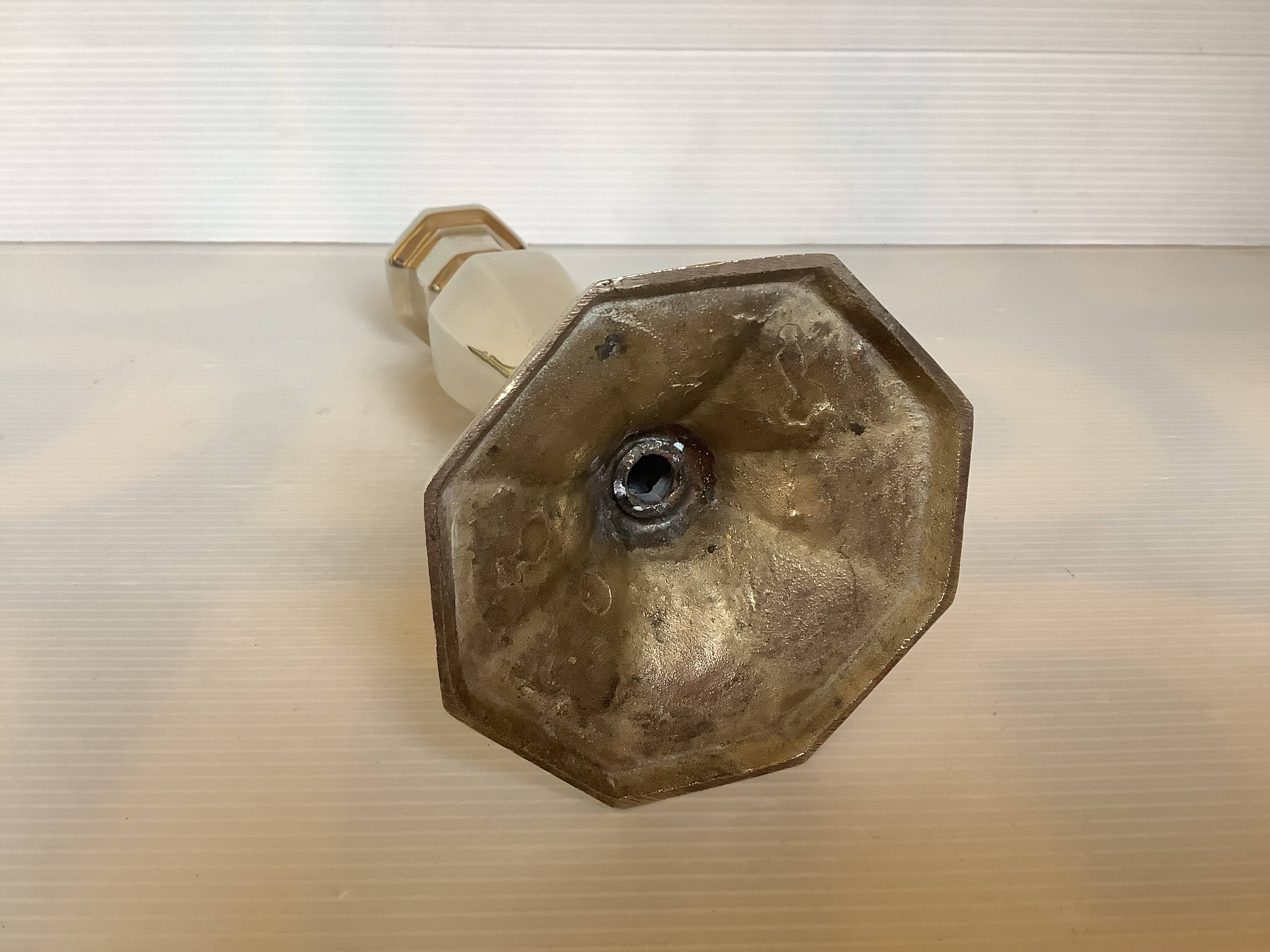 Faceted brass candle holder