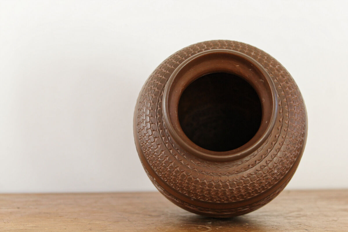 Carved terracotta vase, signed