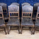 Set of 8 Renaissance style chairs in walnut and embossed leather