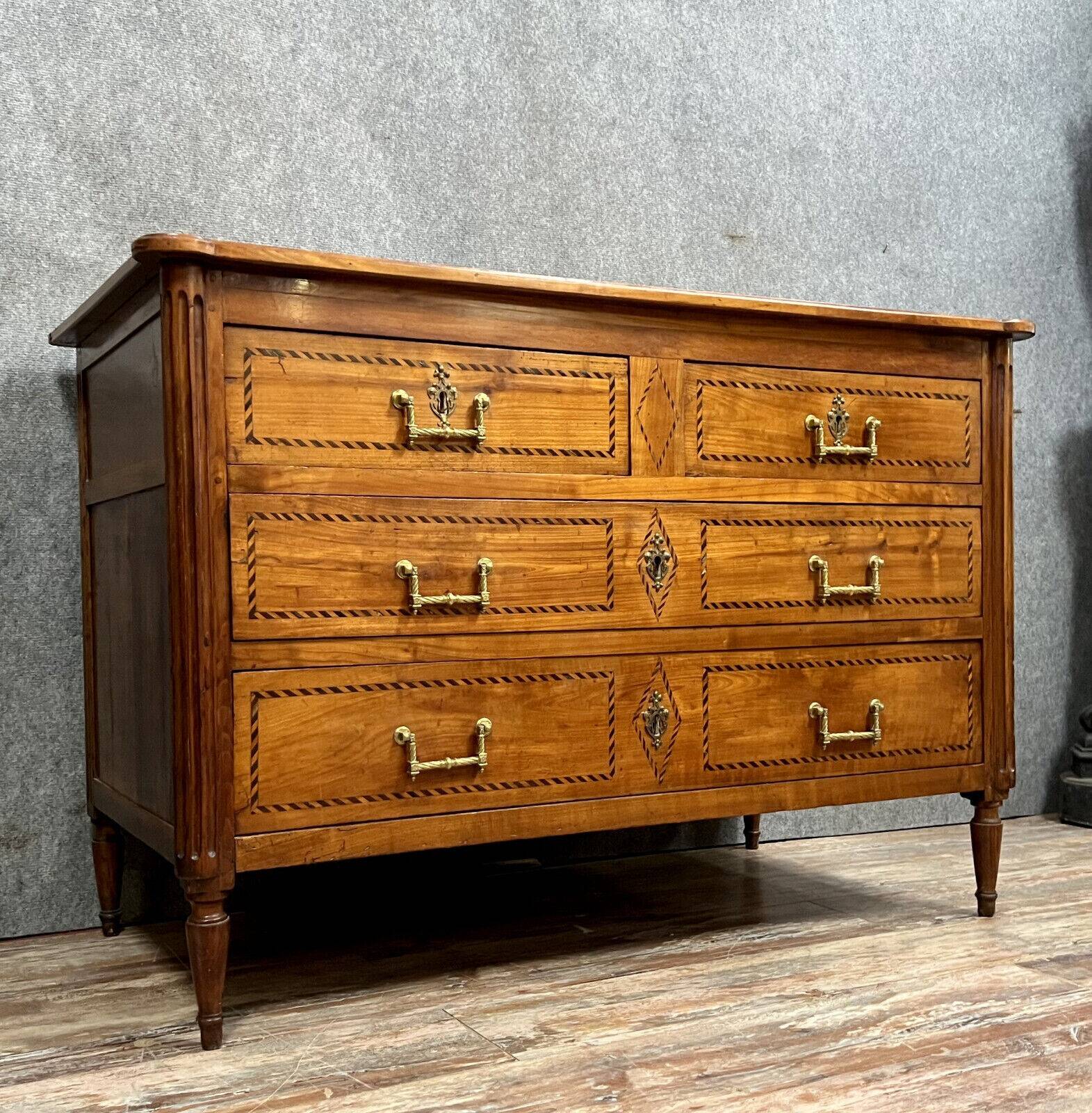 Louis XVI period Grenobloise chest of drawers in marquetry around 1760 opening on the front with 4 out of 3 drawers