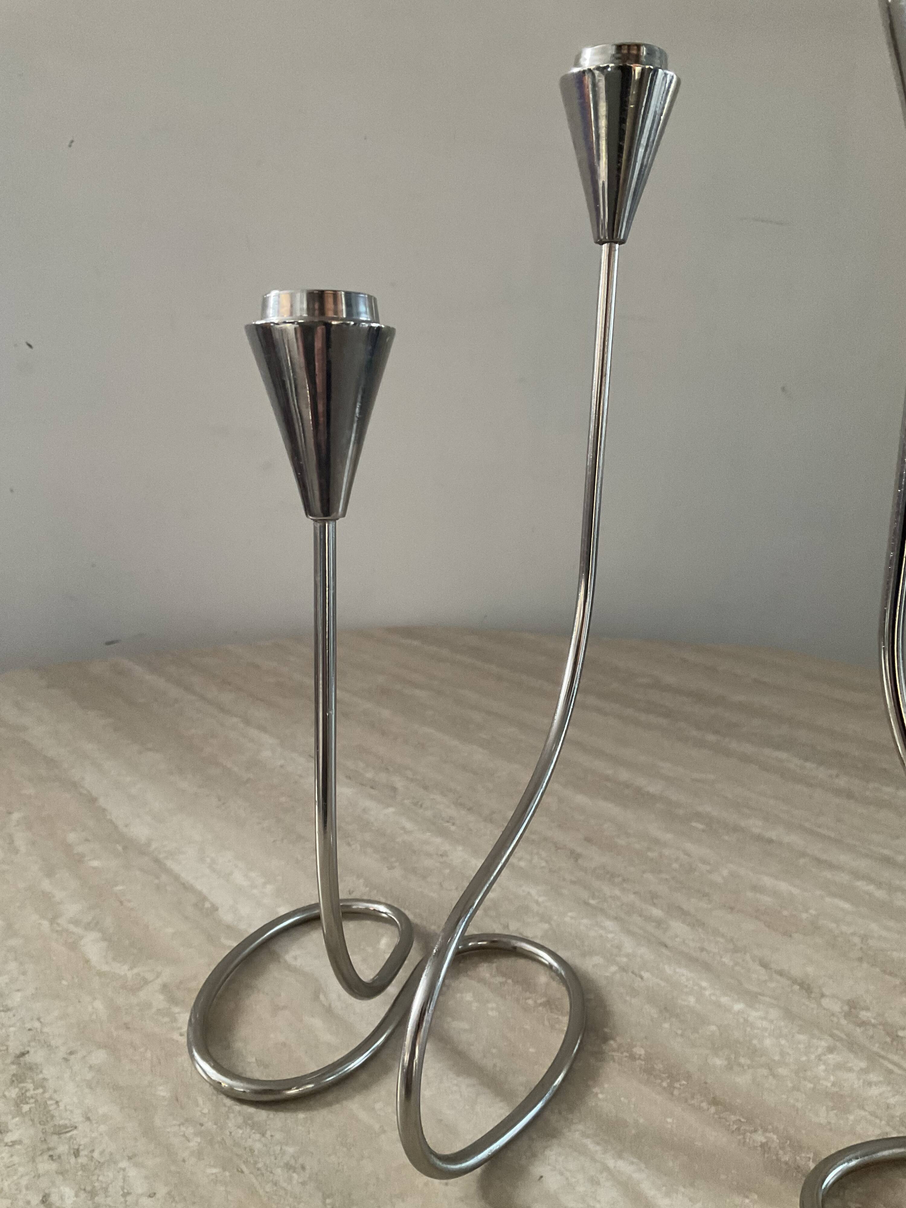 Pair of modernist silver metal candlesticks