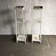 Two white vintage mid-20th century wooden plant stands, 3-tier shelves.