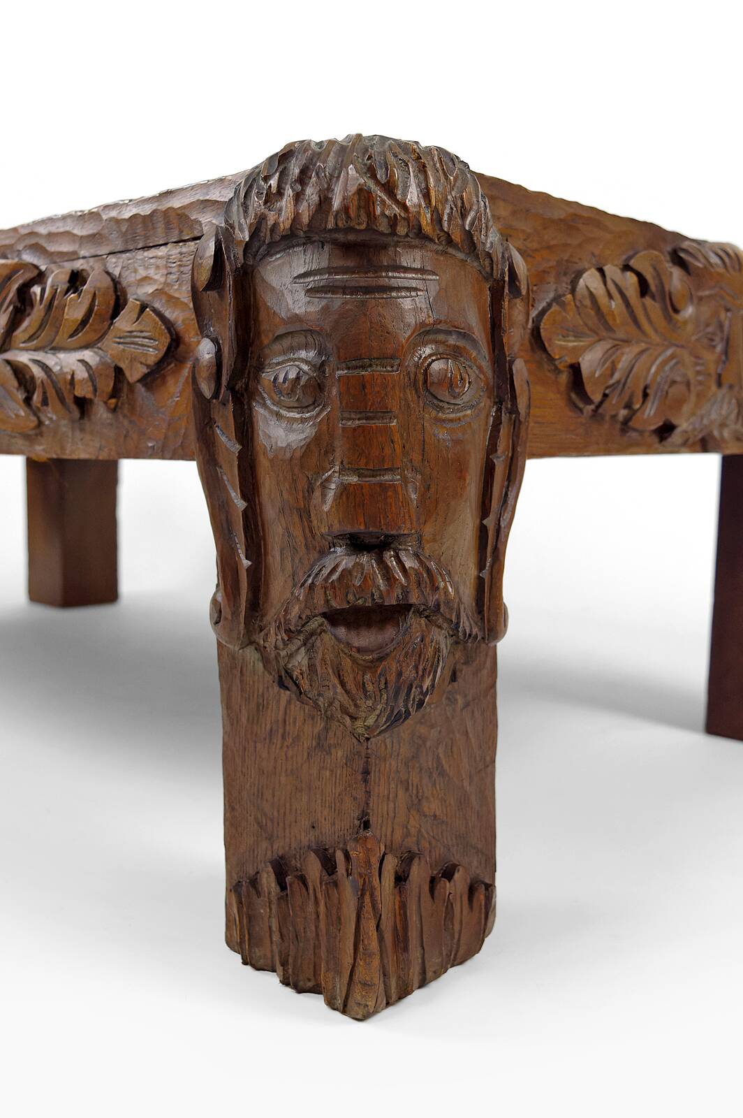 Solid oak coffee table carved with fauns and gray marble top, France, circa 1940