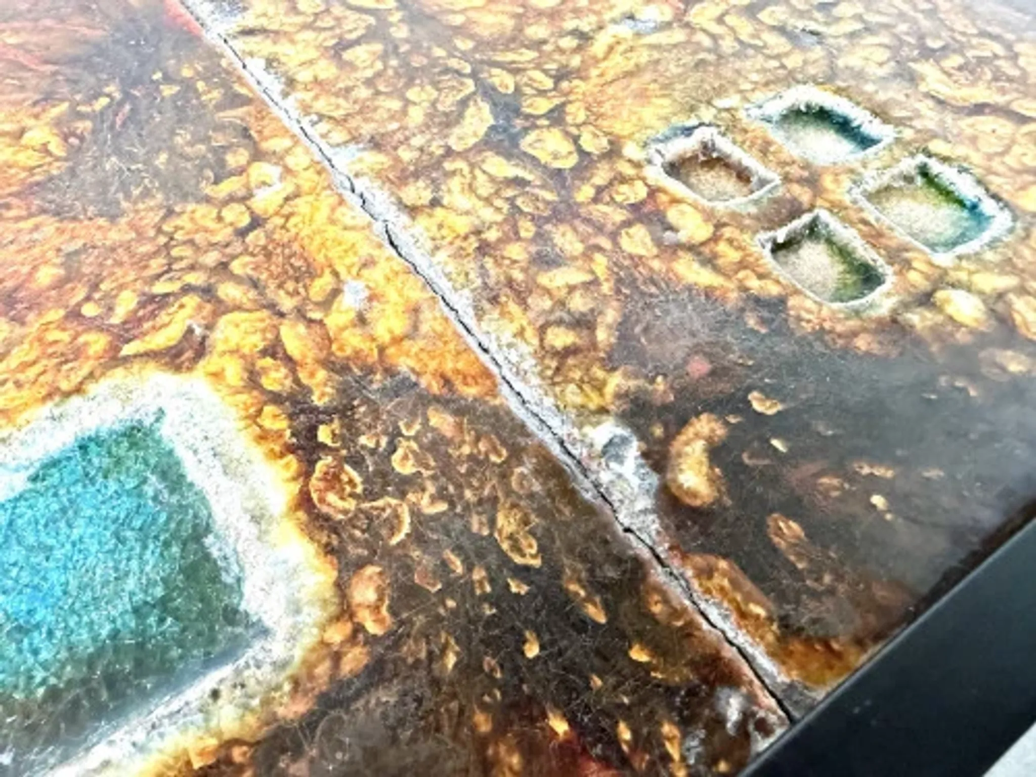 Coffee table by Robert and Jean Cloutier in enamelled lava and metal, 1950s.