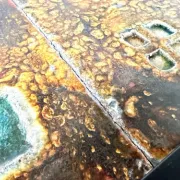 Coffee table by Robert and Jean Cloutier in enamelled lava and metal, 1950s.