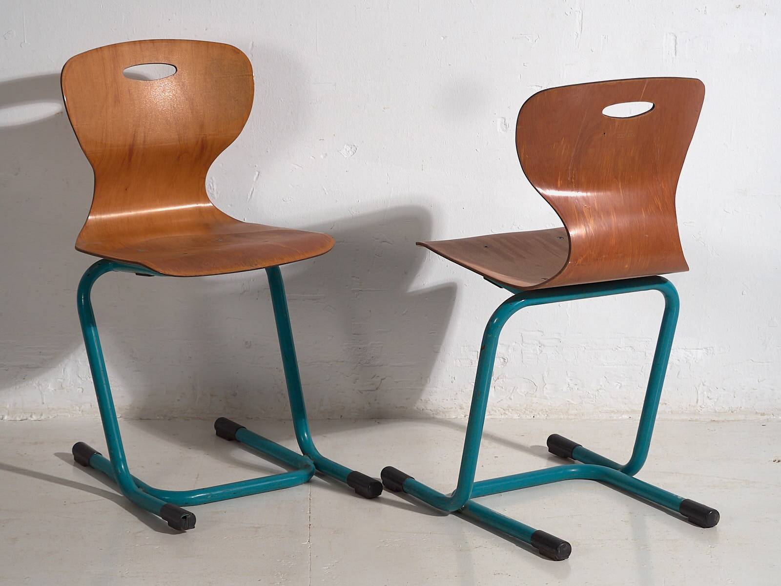 Vintage turquoise blue school chairs (c.1950). Set of 4 pieces
