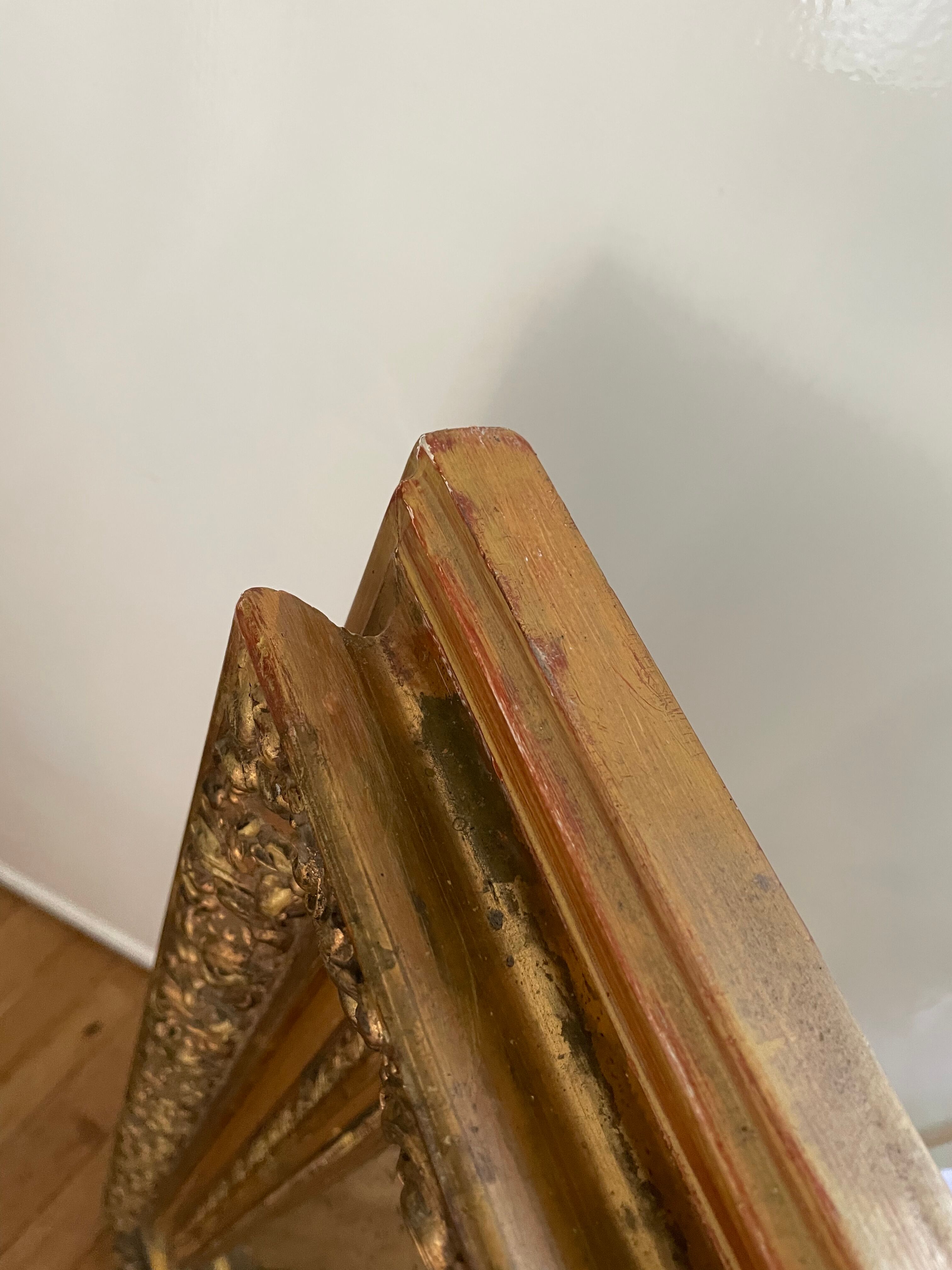 Antique mirror in gilded wood