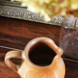 Vintage stoneware pitcher with spout handle