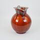 Large red and blue glazed ceramic pitcher signed Delène under the base