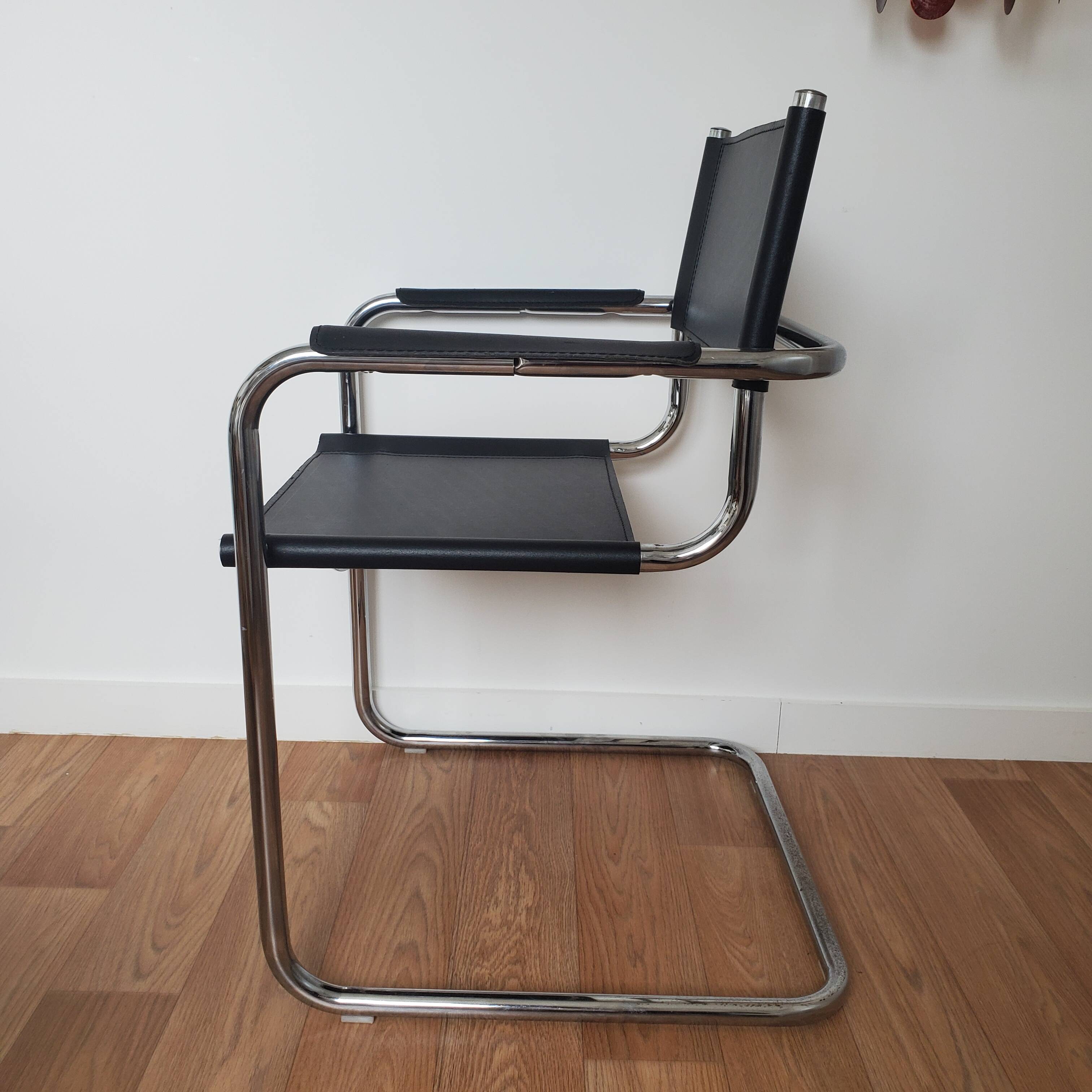 Pair of armchairs in chrome and black leather