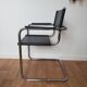Pair of armchairs in chrome and black leather