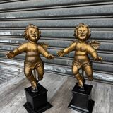 Pair of gilded cherubs on a Napoléon III base