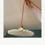 Pleated opaline suspension