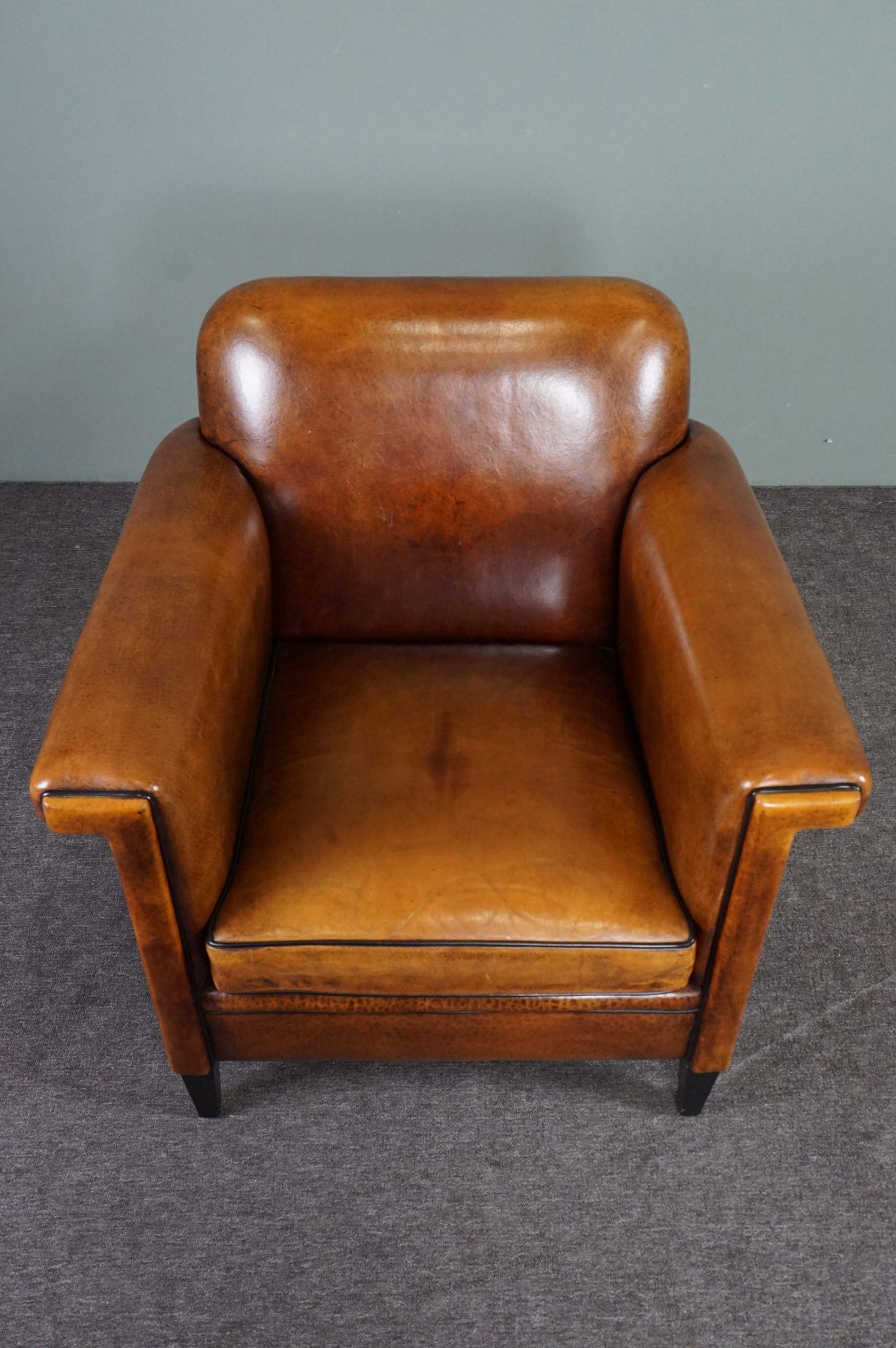 Schapenleren armchair and studio lounge stool