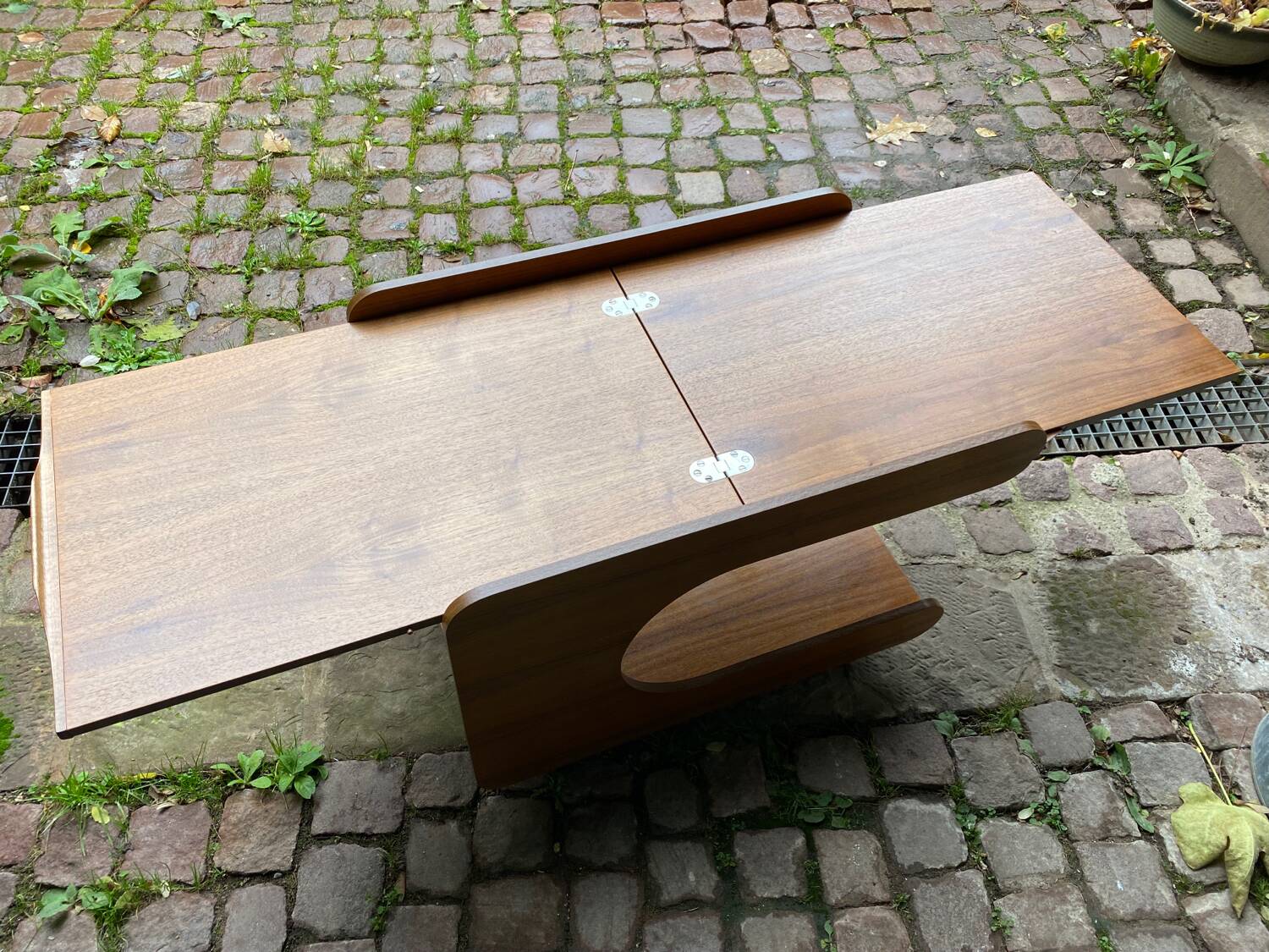 Rolling teak coffee table with foldable top circa 1960