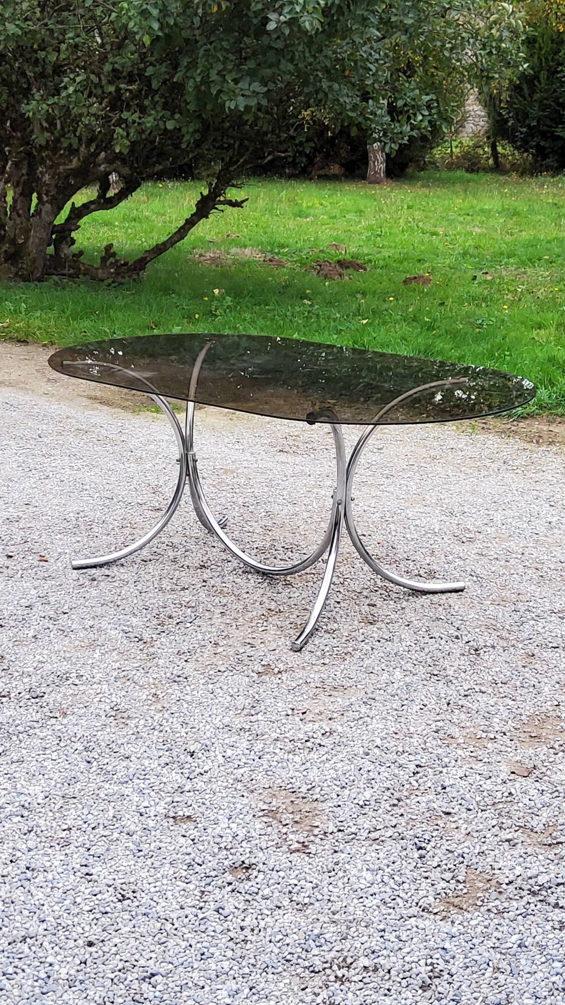 Dining table from the 70s top smoked glass base chrome