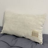 Cushion in vintage fabric with ornamentation