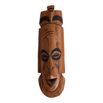 African mask in light wood