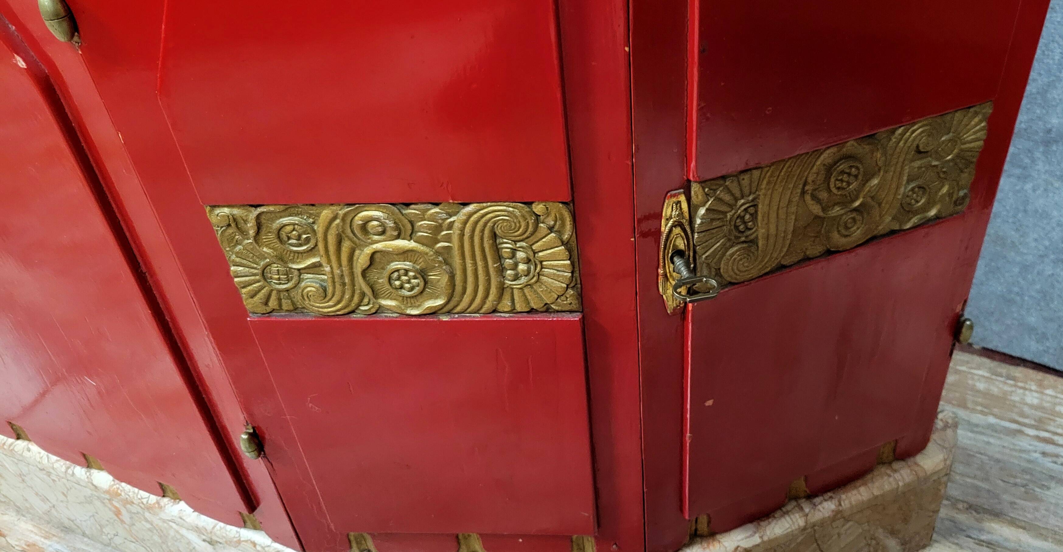 Important Art Deco period bookcase in lacquered wood and gilded bronze
