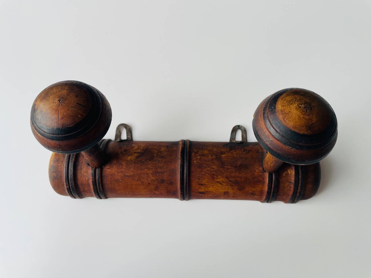 Wooden wall-mounted coat rack with two hooks
