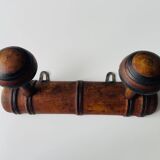 Wooden wall-mounted coat rack with two hooks