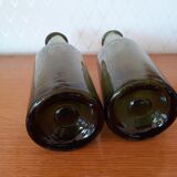 Pair of green bottles made of bubbled blown glass