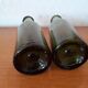 Pair of green bottles made of bubbled blown glass