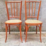 Pair of wooden and cane bistro chairs