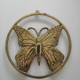 Brass trivet depicting a butterfly