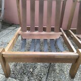 Pair of solid wood and leather lounge chairs, European work, circa 1970.