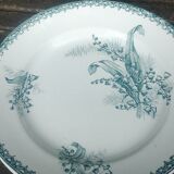 Set of three iron earthenware plates from the St Amandinoise earthenware factory, lily of the valley model.