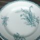 Set of three iron earthenware plates from the St Amandinoise earthenware factory, lily of the valley model.