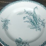 Set of three iron earthenware plates from the St Amandinoise earthenware factory, lily of the valley model.