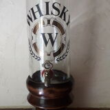 Vintage glass and wood whiskey bottle with pouring tap