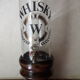 Vintage glass and wood whiskey bottle with pouring tap