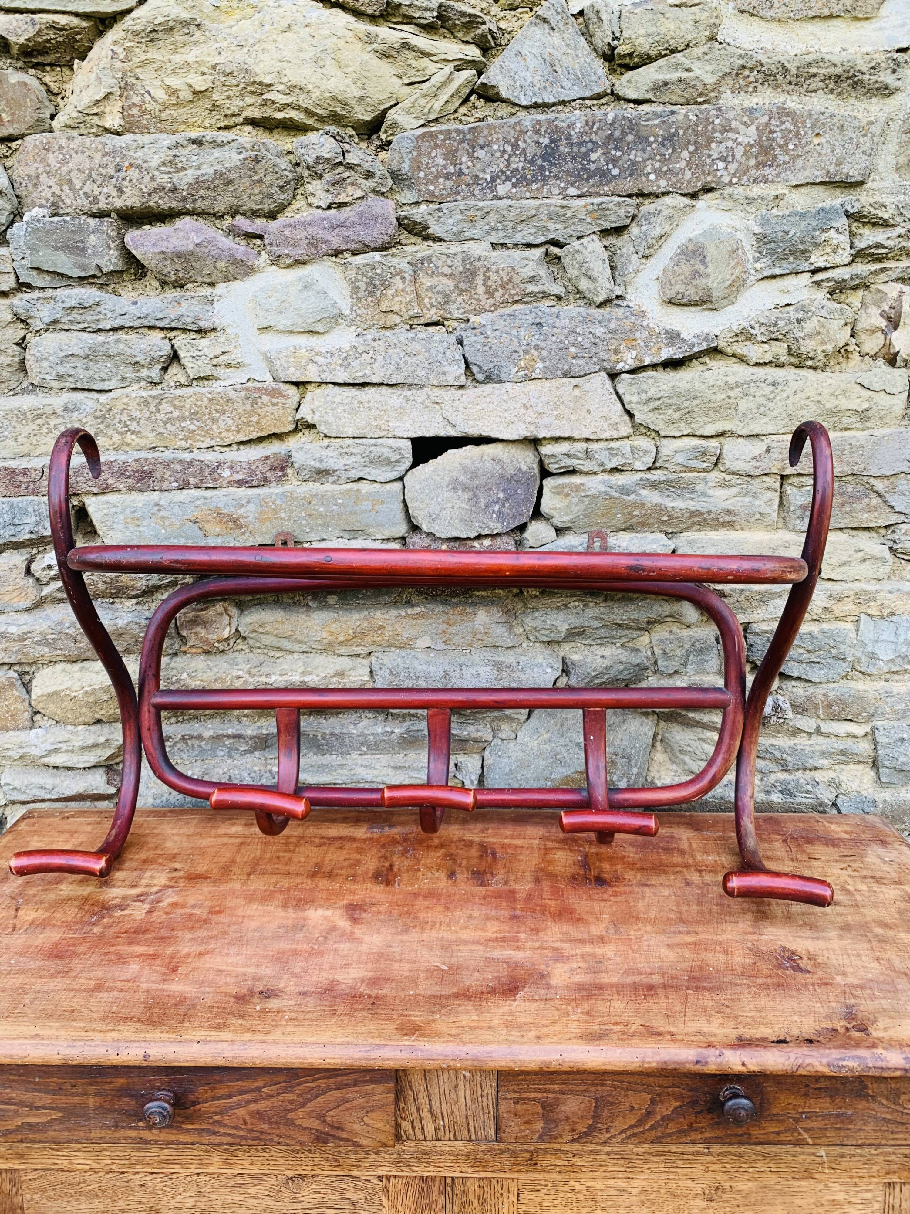 Antique curved wooden wall coat rack