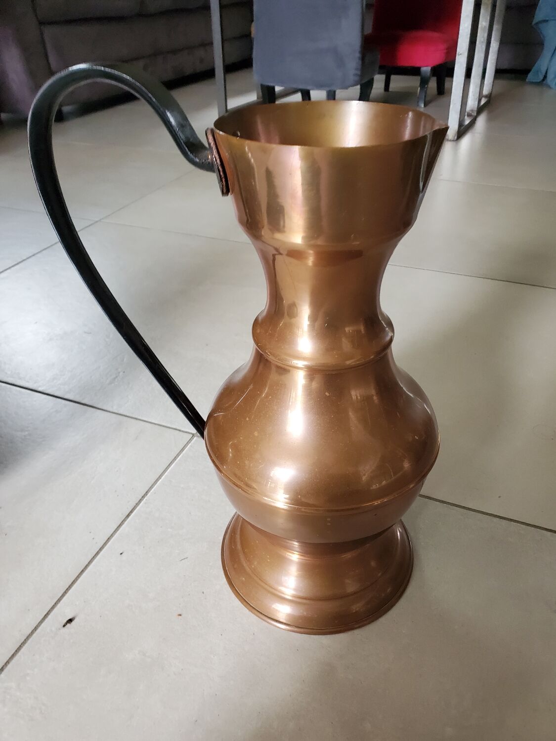 Copper jug with iron handle