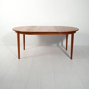 Round extendable teak table by Svante Skogh
