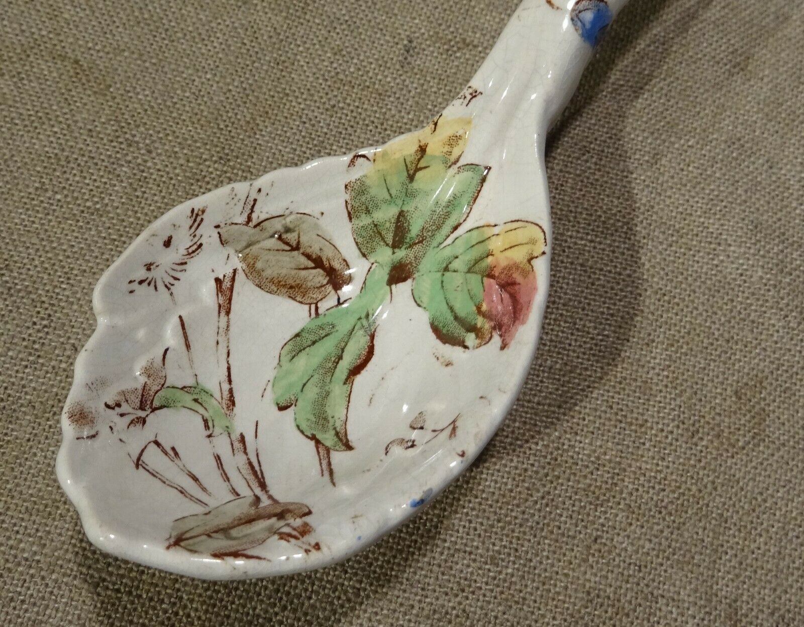 Old spoon with earthenware sauce with floral decoration Longchamp Sarreguemines