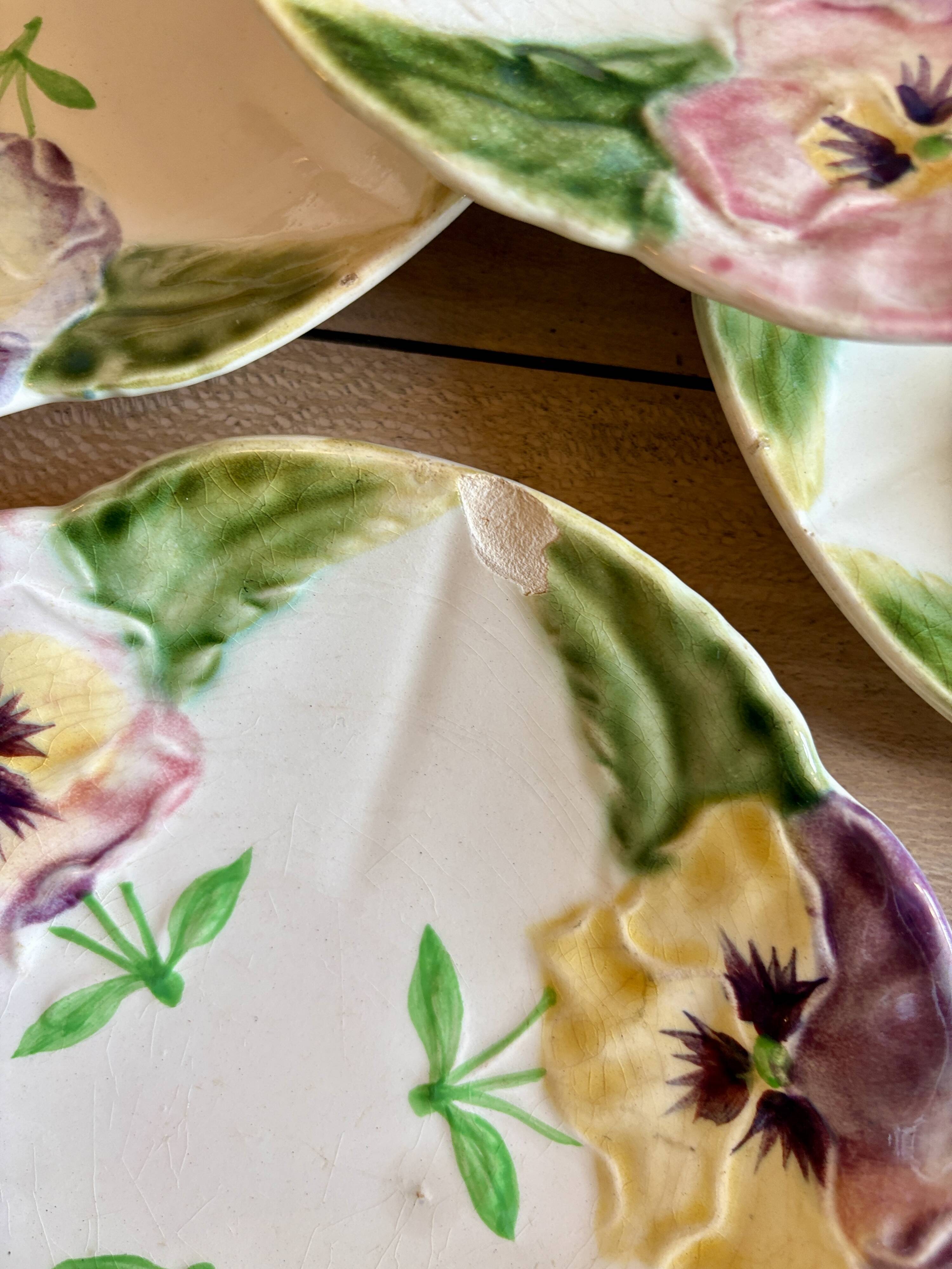 Set of 10 antique slip plates with flower decorations