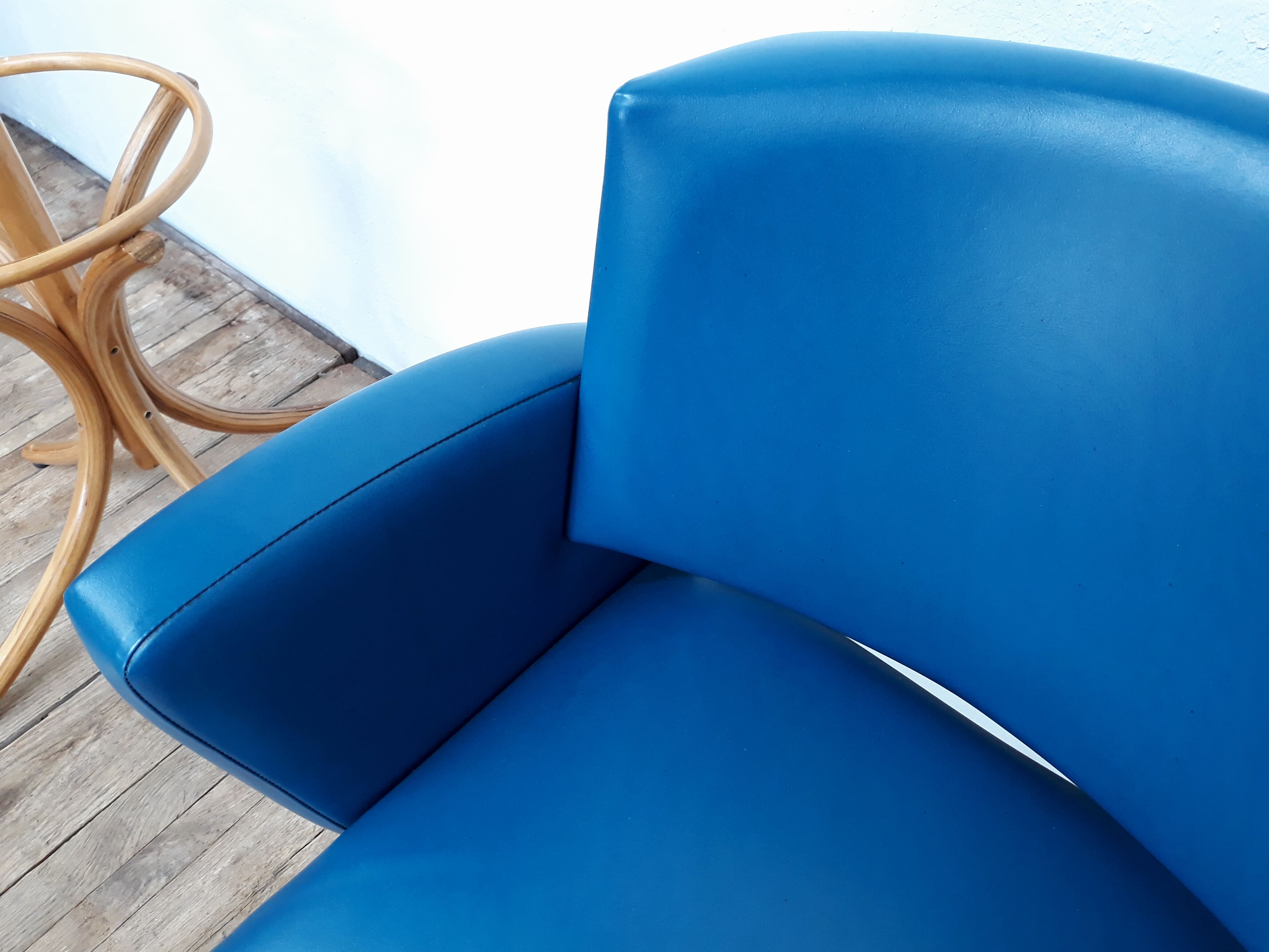 Fauteuil vintage en skaï et pieds métal