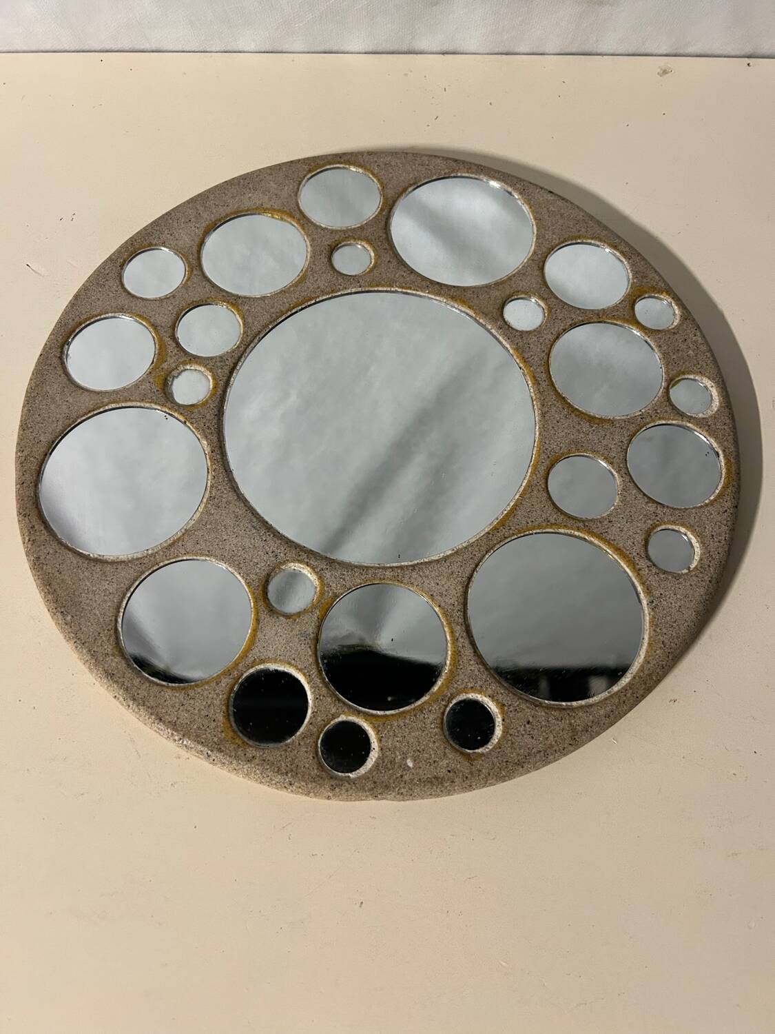 Round ceramic mirror