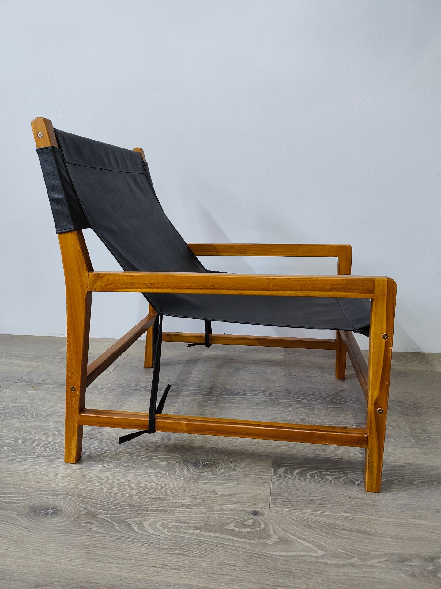 Leather and teak armchair