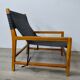 Leather and teak armchair