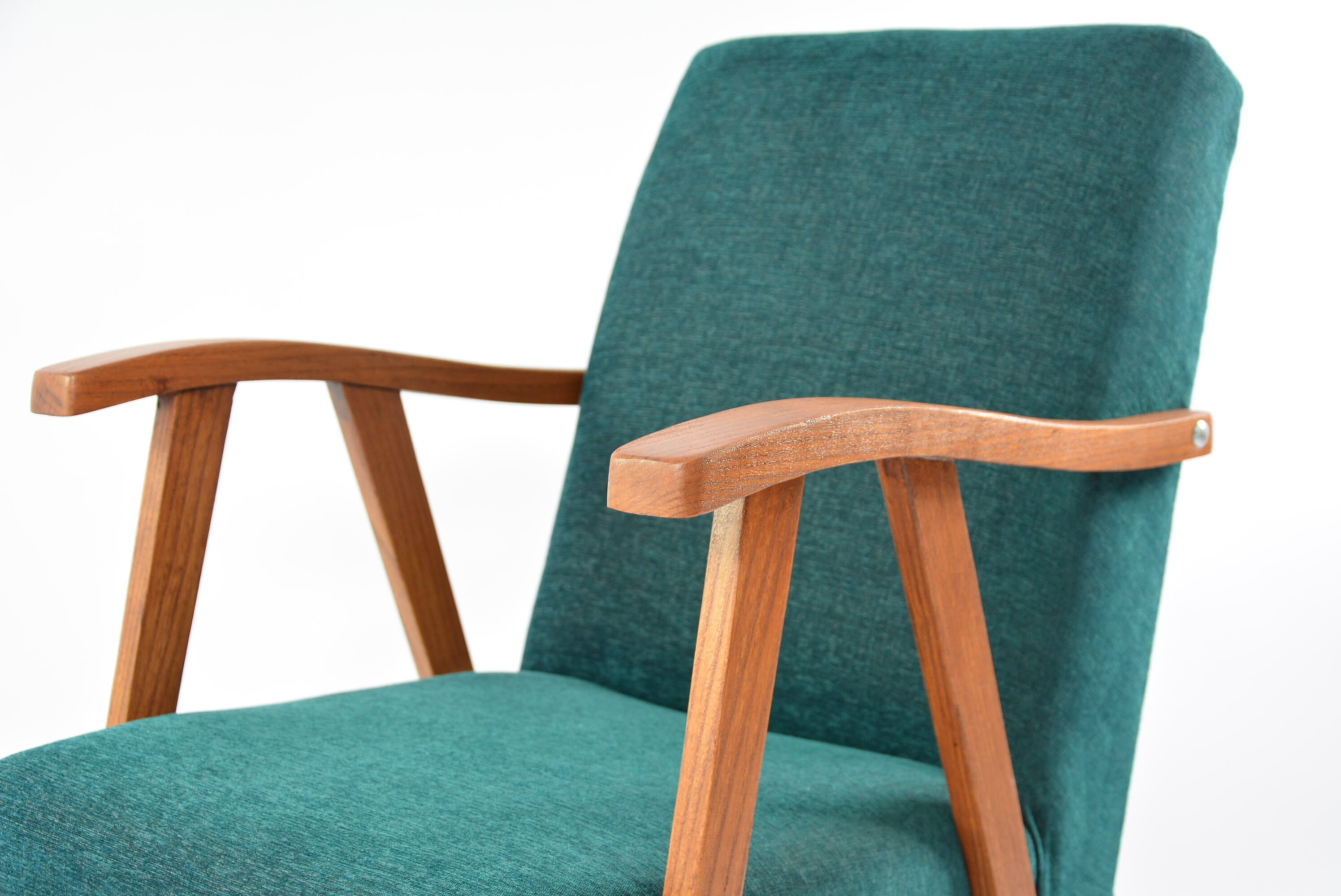 Green curved armchair