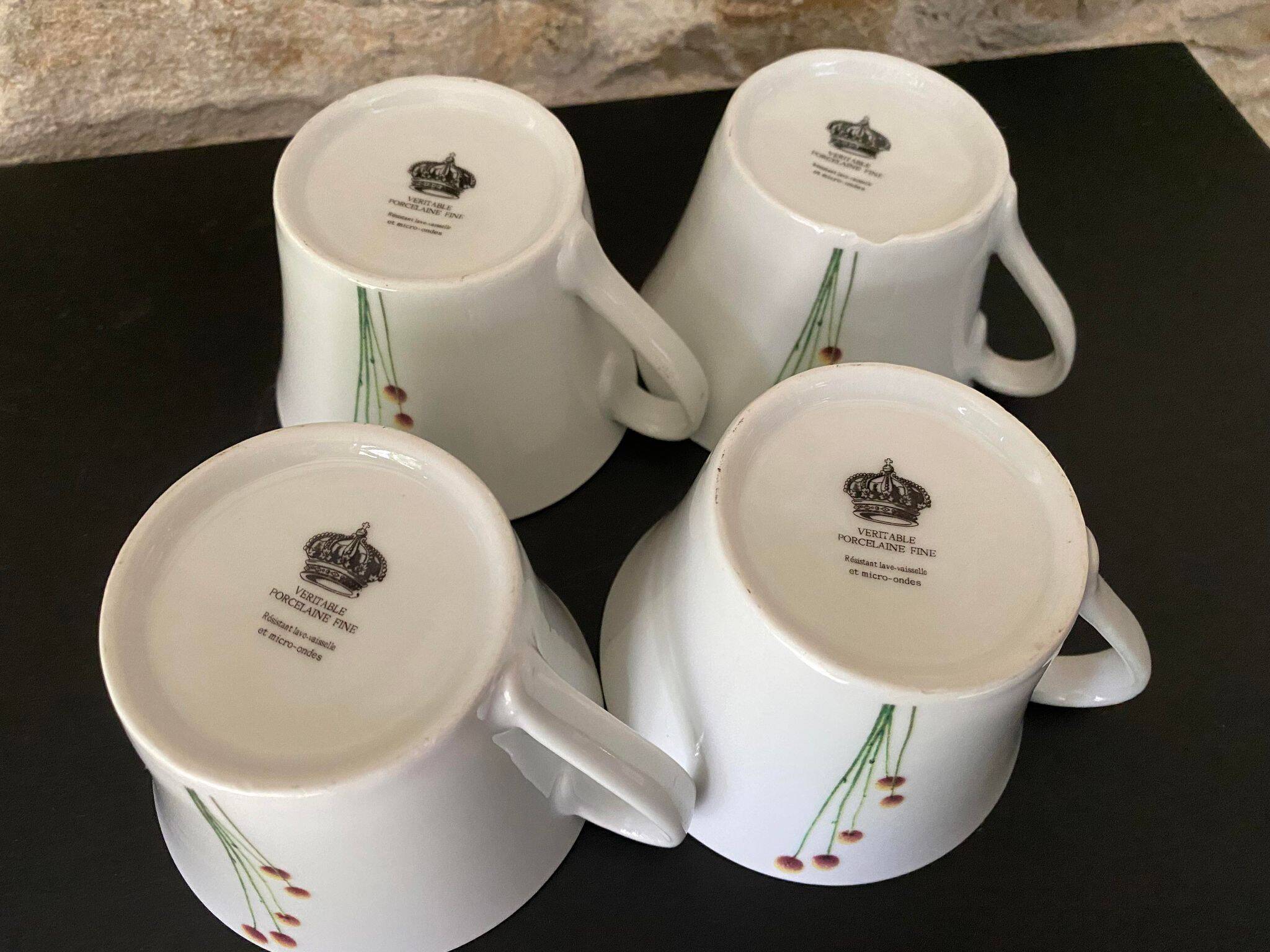 4 fine white porcelain cups with fine flower decoration