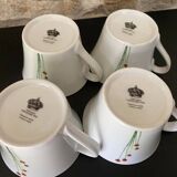 4 fine white porcelain cups with fine flower decoration