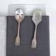 A pair of vintage silver-plated metal serving cutlery (shell).