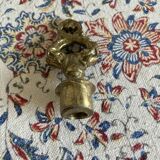 Large brass candlestick with 5 lights and its accessory for extinguishing candles