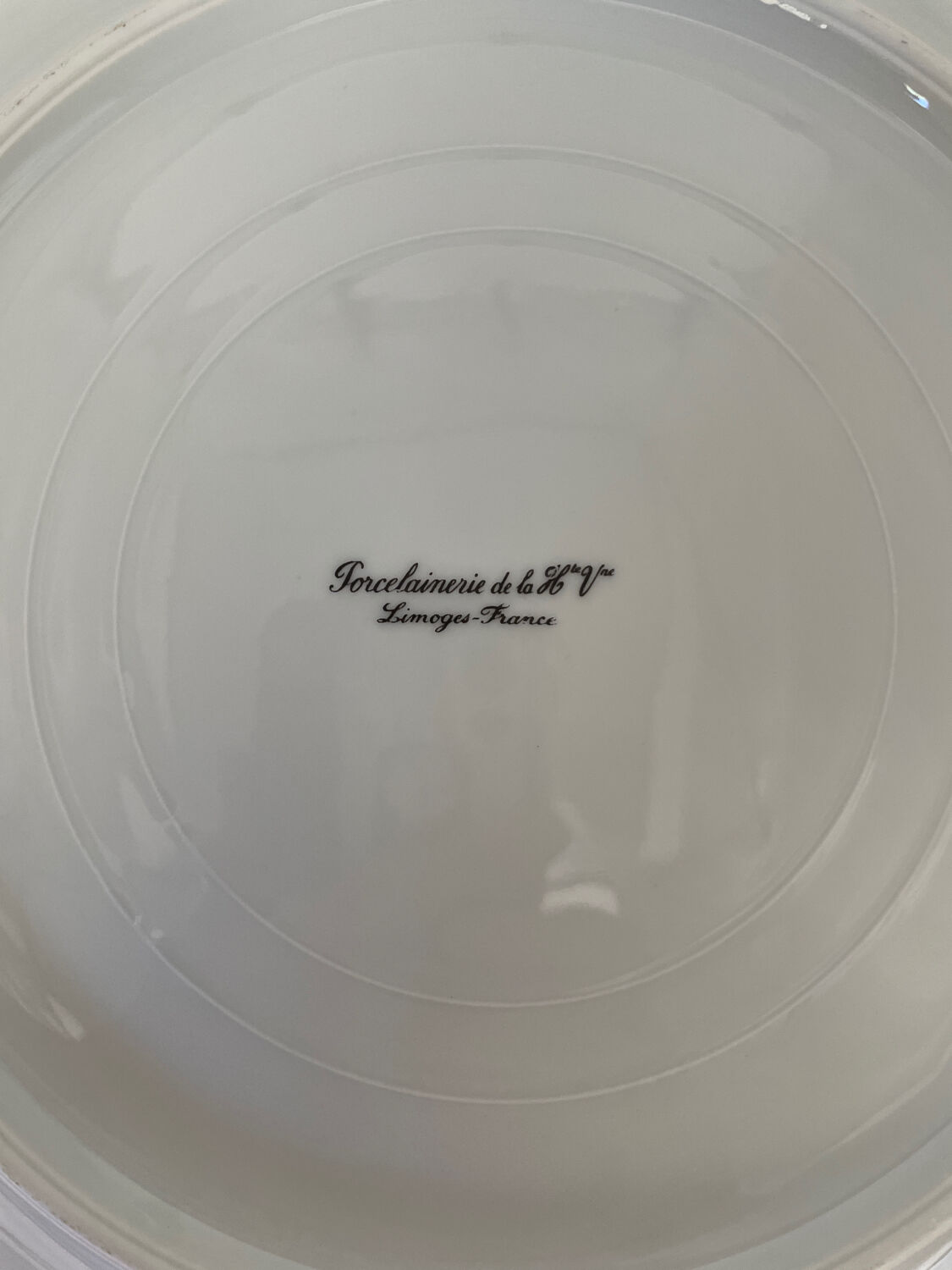 Six slightly hollow Limoges porcelain plates.